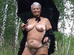 Gray hair village granny flashing in the forest